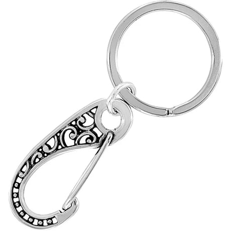 Silver keychain with intricate design on a white background