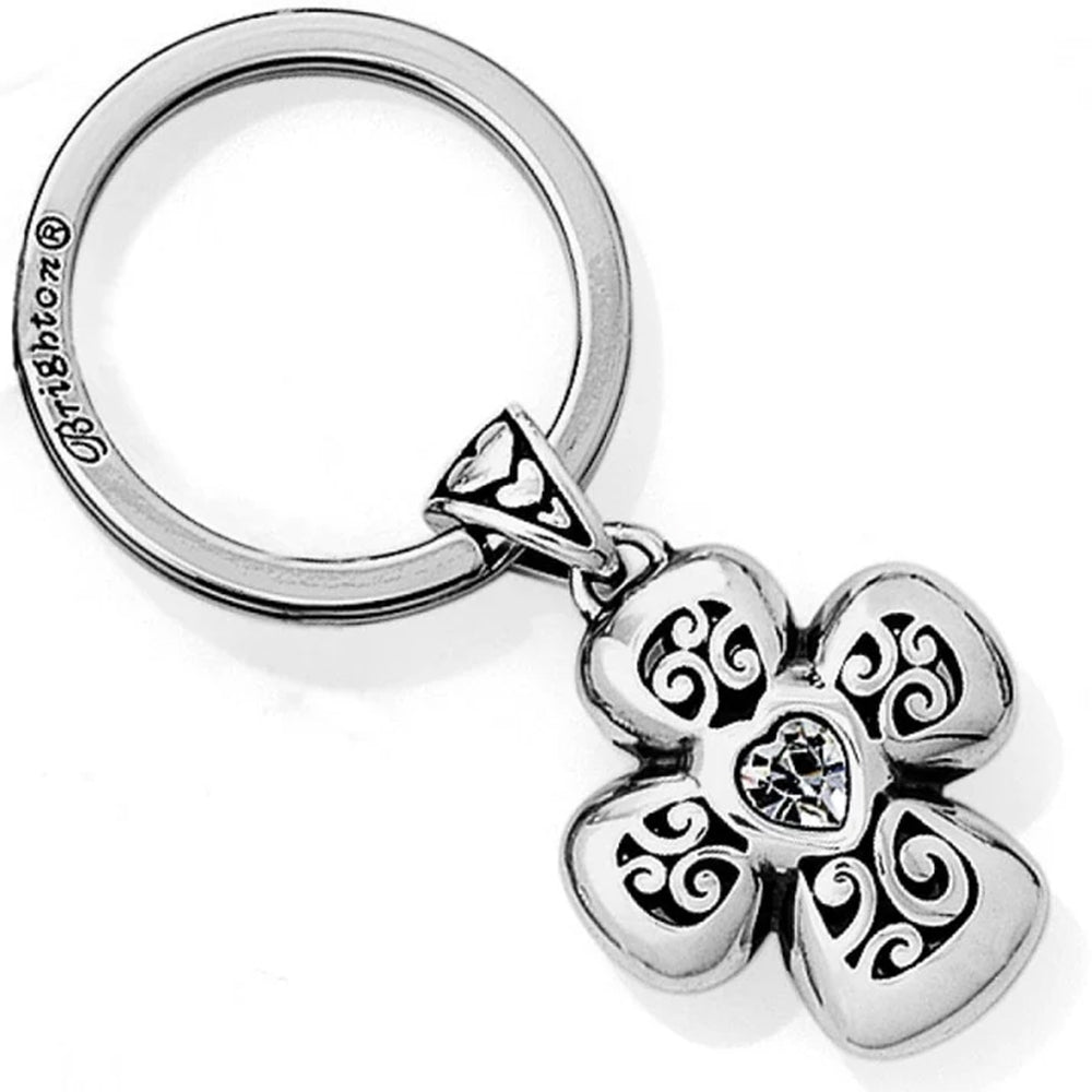 Silver keychain with a decorative flower pendant on a white background