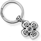 Silver keychain with a decorative flower pendant on a white background