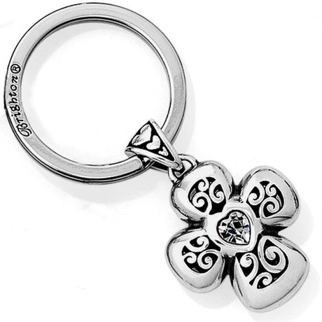Silver keychain with a decorative flower pendant on a white background