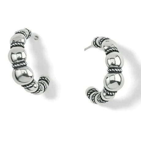 Pair of silver hoop earrings on a white background