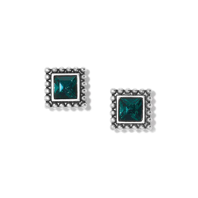 Pair of square stud earrings with teal gemstones on a white background