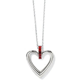 Heart-shaped pendant with red gemstone on a white background