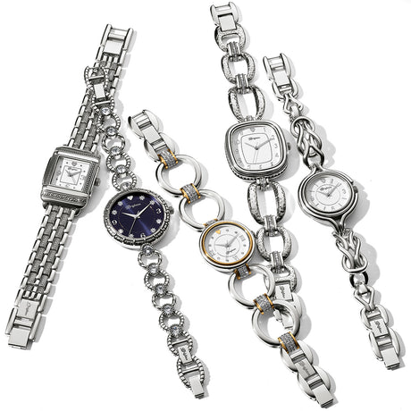 Collection of silver watches with various designs on a white background
