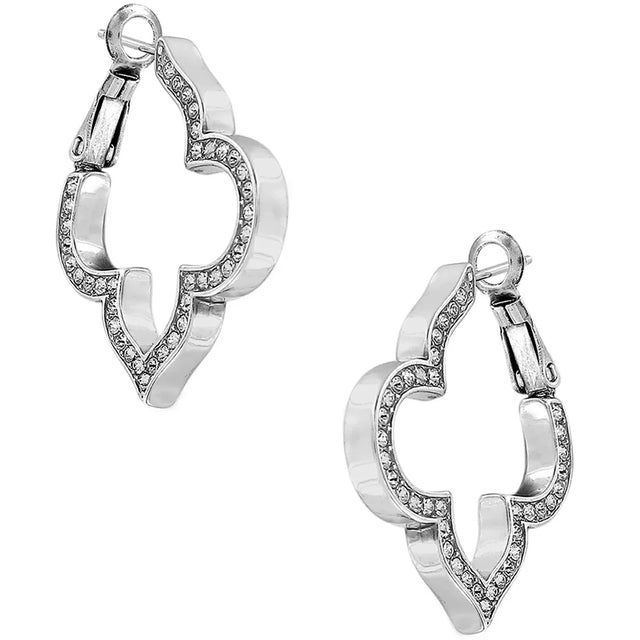 Pair of silver hoop earrings with small stones on a white background