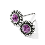 Silver earrings with purple gemstones on a white background