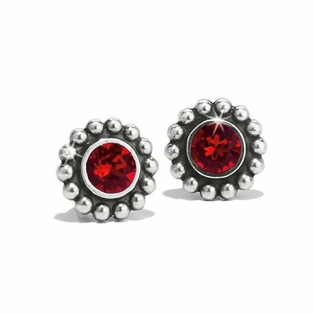 Silver earrings with red gemstones on a white background