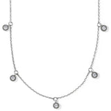 Silver necklace with small circular pendants on a white background