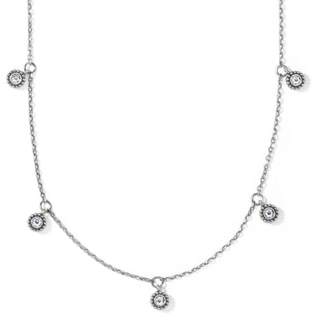 Silver necklace with small circular pendants on a white background