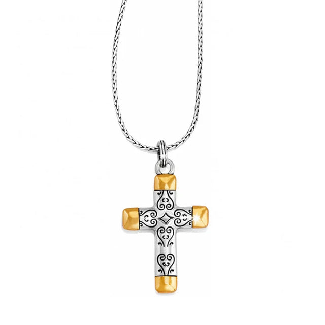 Cross-shaped pendant with gold accents on a white background