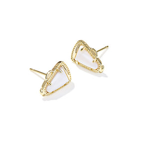 Gold earrings with white stones on a white background