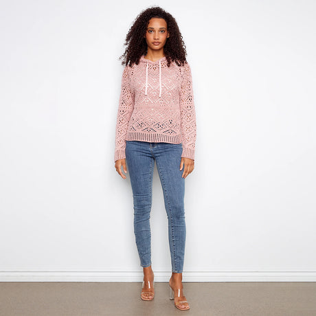pink crochet sweater hoodie on woman with jeans on