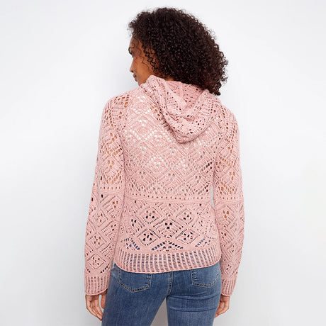 pink crochet sweater hoodie on woman with jeans on