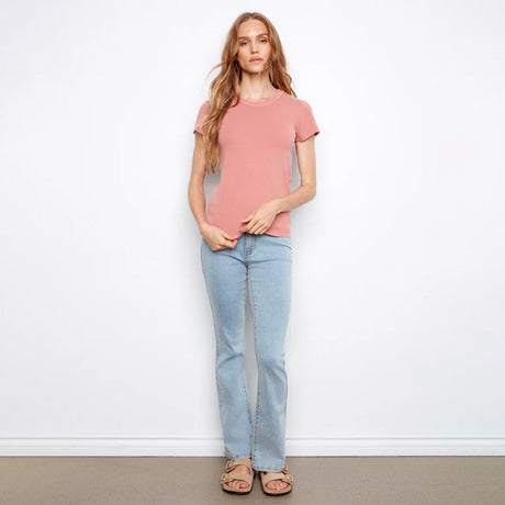 Woman wearing pink shirt on white background