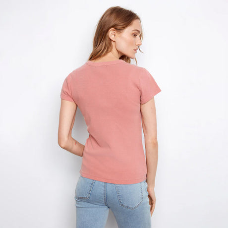 Woman wearing pink shirt on white background