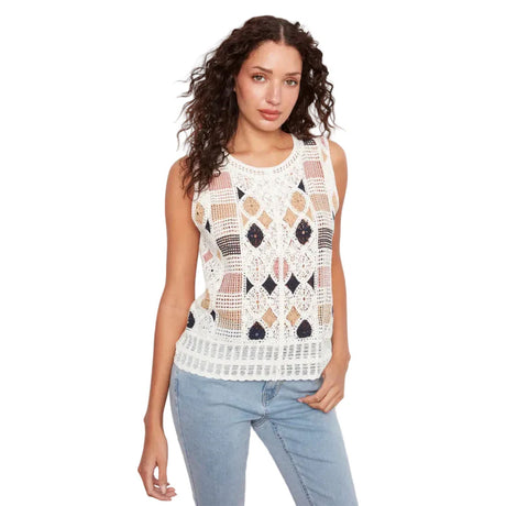 Woman wearing a sleeveless crochet top with geometric pattern on a white background