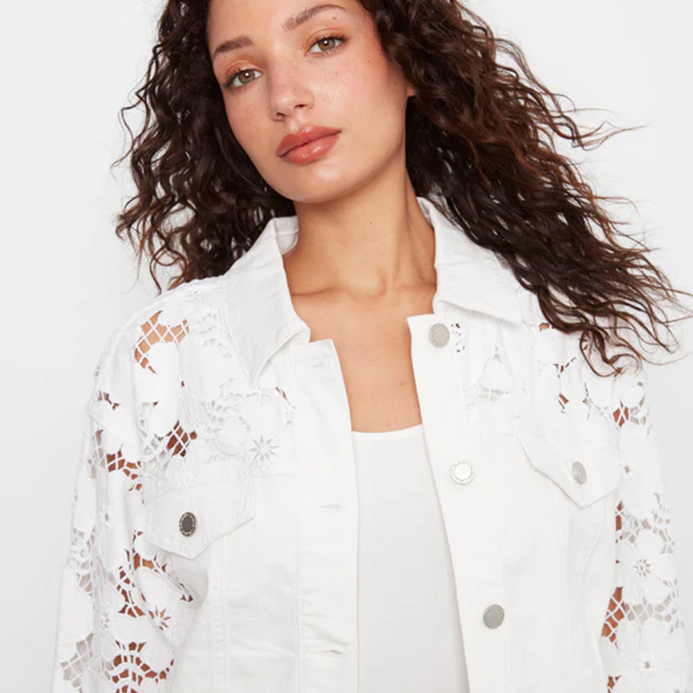 Woman wearing a white lace-trimmed jacket on a white background