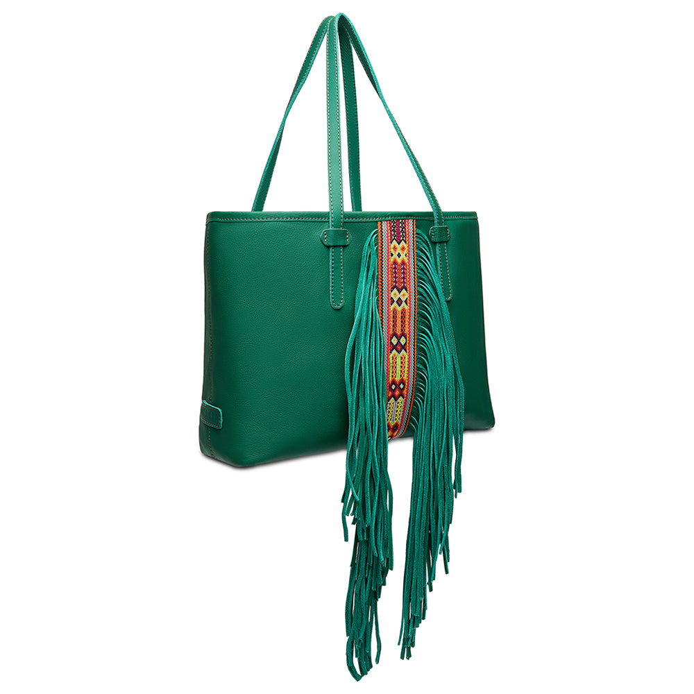 Green handbag with a colorful strap and fringes on a white background