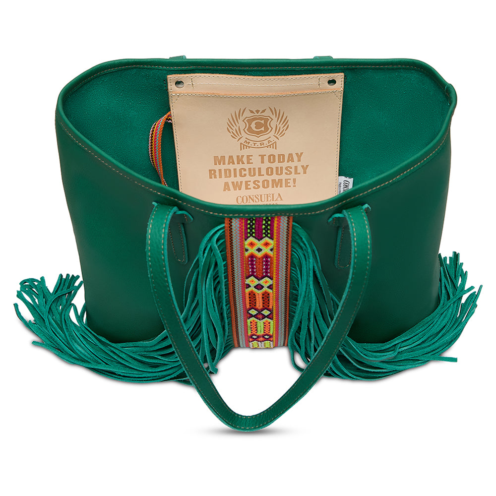 Green leather handbag with fringes and a motivational tag on a white background