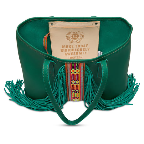 Green leather handbag with fringes and a motivational tag on a white background