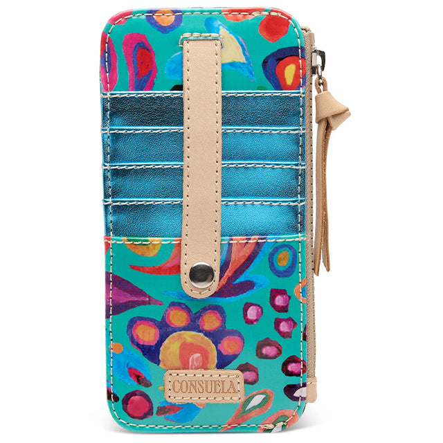 A Consuela zip-around wallet with a vibrant multicolor floral print on a turquoise background, featuring beige faux-leather trim, card slots, and a wristlet strap.