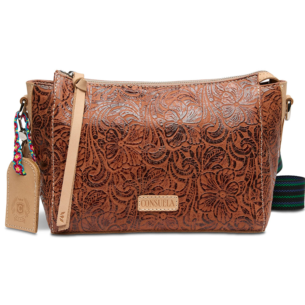 Brown leather handbag with floral patterns on a white background