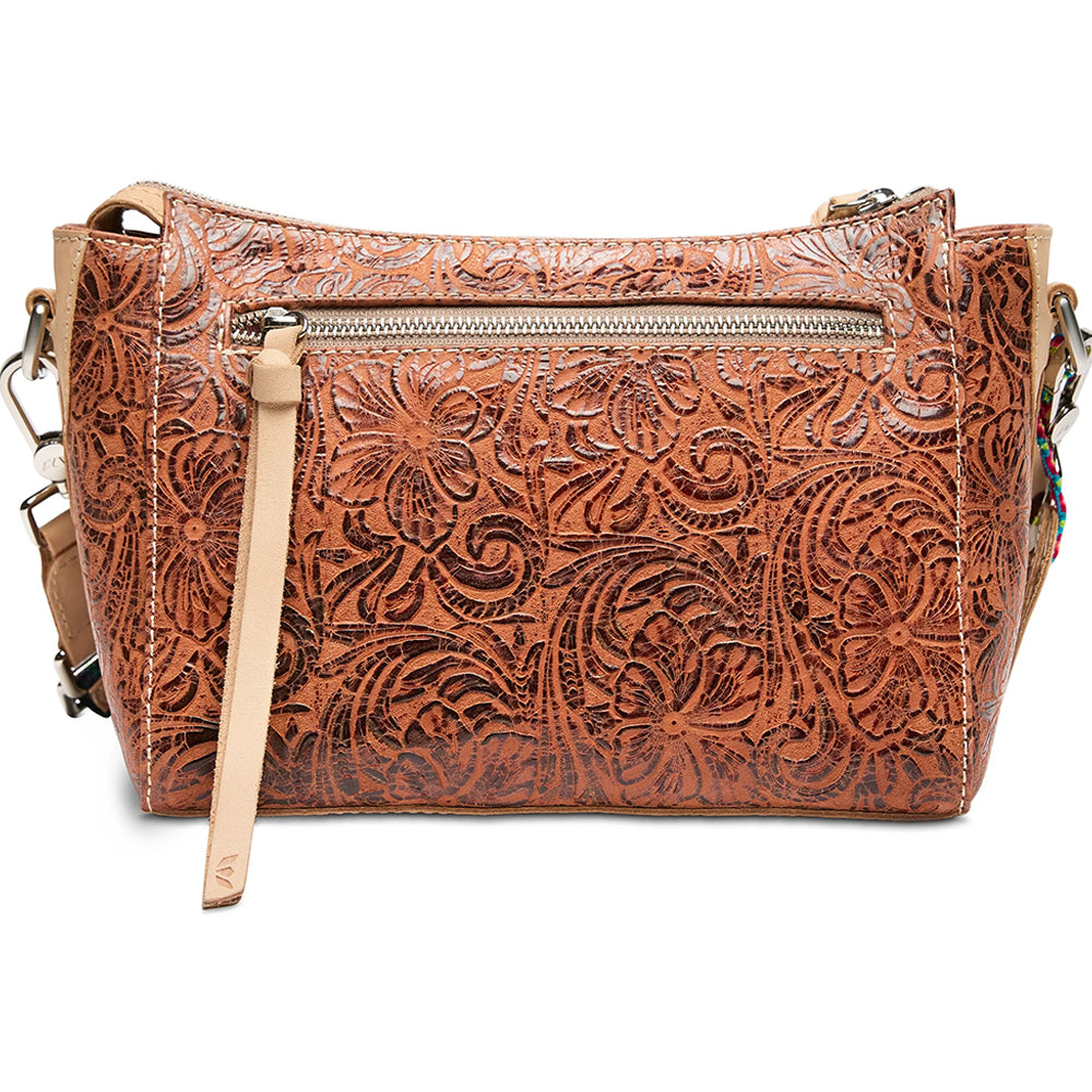 Brown leather handbag with intricate patterns on a white background