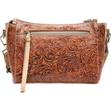 Brown leather handbag with intricate patterns on a white background