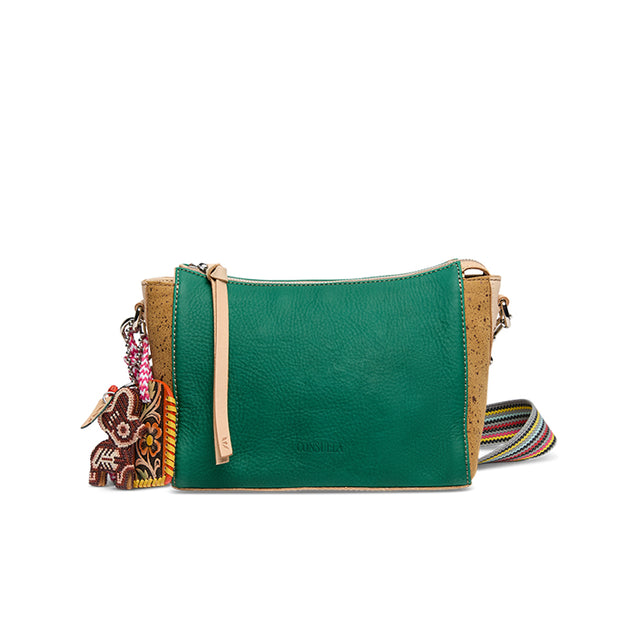 Green handbag with a colorful strap and charm on a white background