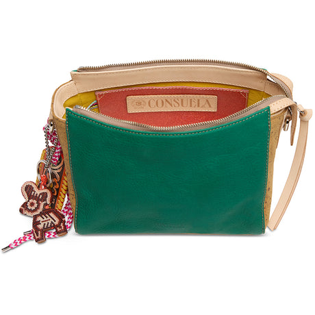 Green handbag with beige strap and colorful charm on a white background