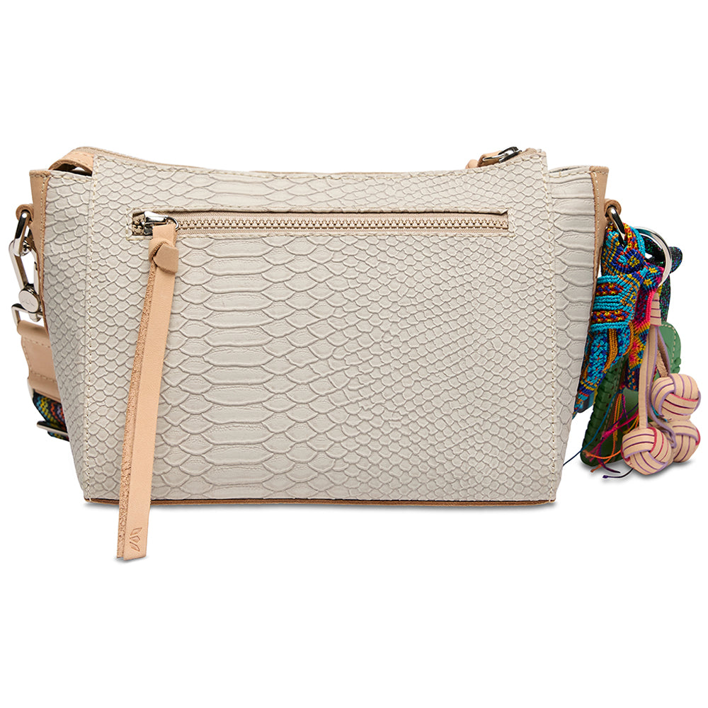 Beige textured handbag with a colorful strap on a white background