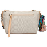 Beige textured handbag with a colorful strap on a white background