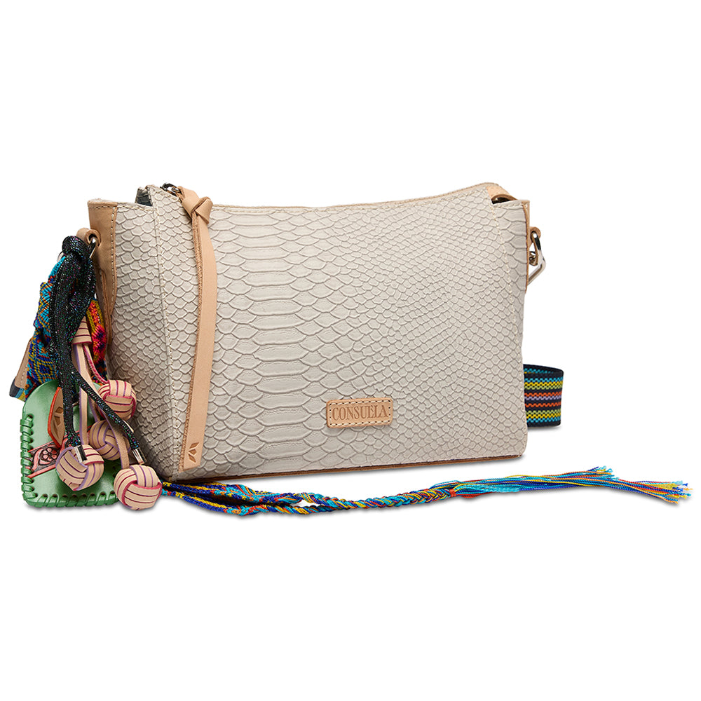 Beige handbag with colorful tassels on a white background