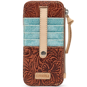 A zip-around wallet with a brown tooled leather exterior, a turquoise glitter side panel, and a pink faux-leather window insert, shown on a white background.