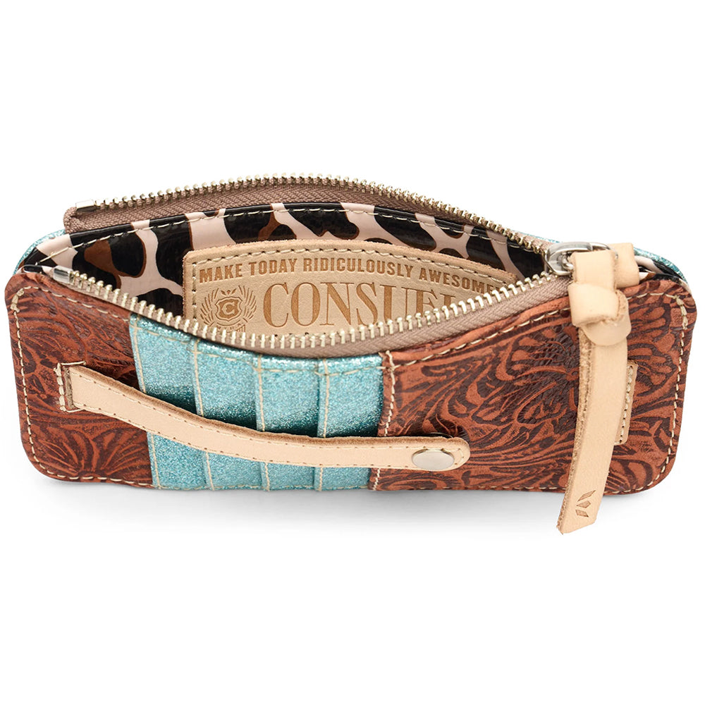 A zip-around wallet with a brown tooled leather exterior, a turquoise glitter side panel, and a pink faux-leather window insert, shown on a white background.