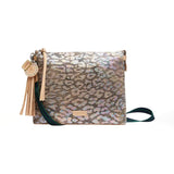 Leopard print clutch bag with tassel on a white background