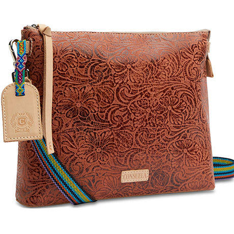 Brown leather pouch with intricate patterns, colorful strap, and visible brand logo on a white background.