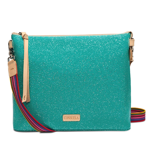 A turquoise glitter purse with a gold zipper and a tan leather brand patch inside, shown open on a white background.