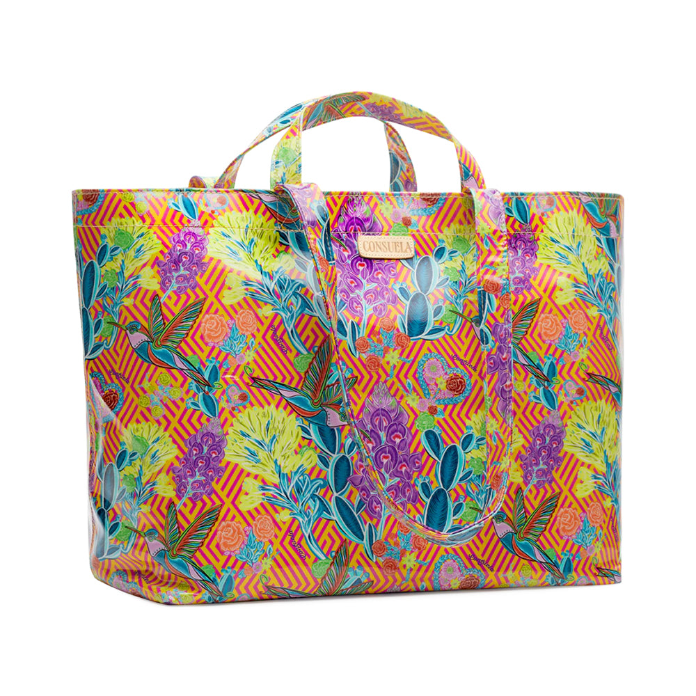 Colorful tote bag with floral and geometric pattern on a white background
