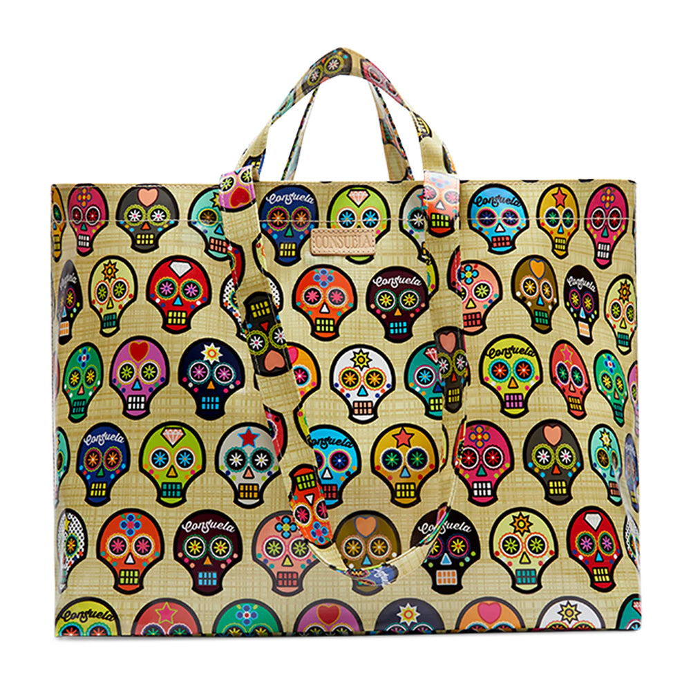 Tote bag with colorful sugar skull pattern on a beige background