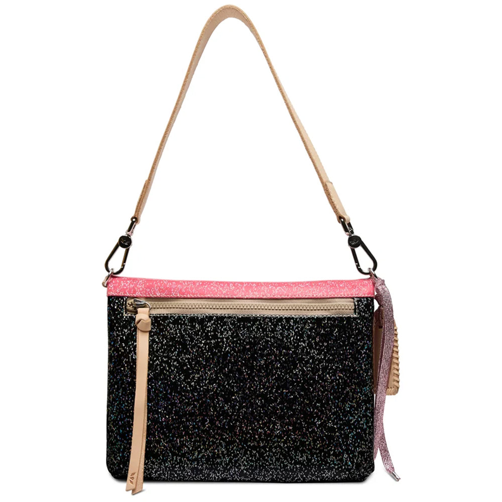 A black glitter crossbody bag with a bright pink glitter trim along the top, a beige shoulder strap, and a front zippered pocket with a beige pull tab.