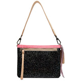 A black glitter crossbody bag with a bright pink glitter trim along the top, a beige shoulder strap, and a front zippered pocket with a beige pull tab.