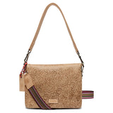 A tan tooled leather crossbody with floral embossed patterns, featuring multiple zippered compartments, a card slot with a blue denim insert, and a yellow ID window.