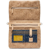 A tan tooled leather wallet with floral embossed patterns, featuring multiple zippered compartments, a card slot with a blue denim insert, and a yellow ID window.