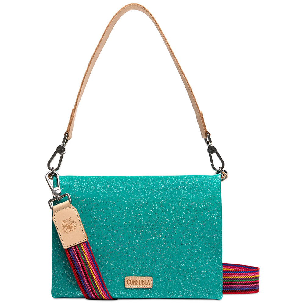 A turquoise glitter shoulder bag with a tan leather strap and a colorful striped woven shoulder strap, shown on a white background.