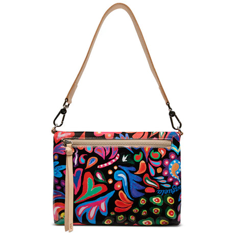a colorful handbag with floral decorations, with a white background