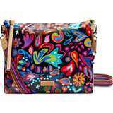 Colorful floral-patterned handbag with a visible brand logo on a white background
