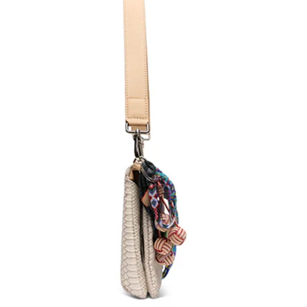 Small handbag with a beige strap and colorful embellishments on a white background
