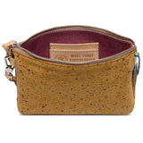Brown cork handbag with a visible brand tag on a white background
