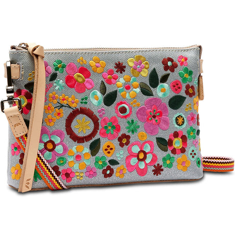 Colorful floral embroidered clutch bag with a strap on a white background